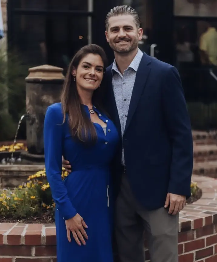 A man and woman standing next to each other.